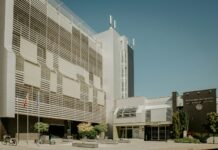 정부 “일방적 진료 취소는 ‘진료거부’…불법행위에 엄정 대응” a large building with a lot of windows on the side of it