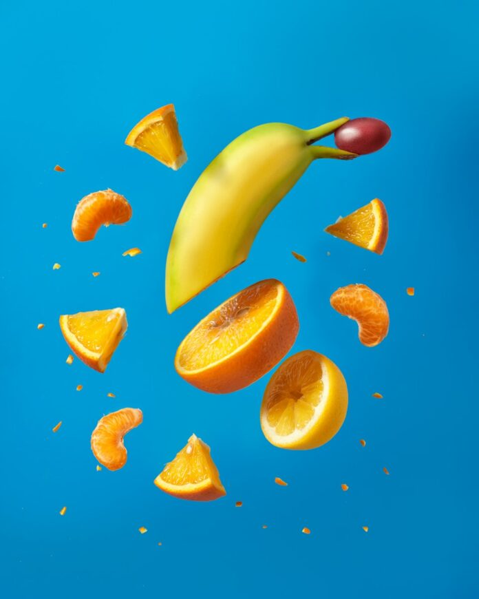 Photo by Tangerine Newt sliced lemon fruit on blue surface