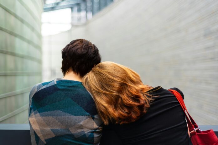 Photo by Transly Translation Agency a woman rests her head on another person's shoulder