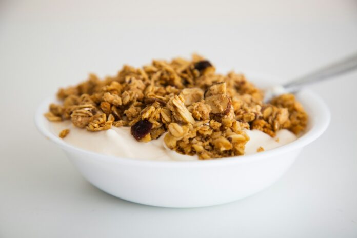 Photo by Dean Ricciardi a bowl of granola and yogurt with a spoon
