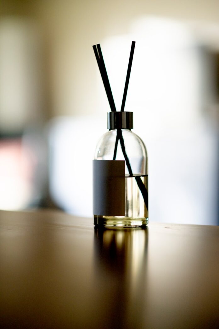 Photo by Ryul Davidson clear glass bottle with gold lid