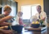“슬로우 라이프” 열풍, 일상 속 작은 변화로 건강 지키기 Grandfather and grandchildren prepare food in kitchen