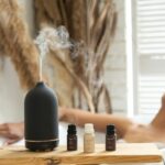 일상 속 대체요법, 작은 실천이 건강을 바꾼다 a woman laying in a bathtub next to a bottle of essential oils
